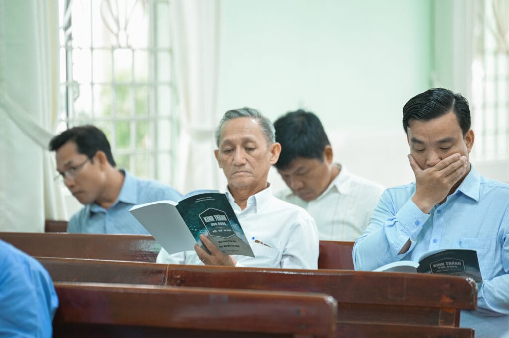 Pastors in Vietnam engaging with the Life Essentials Study Bible sample.